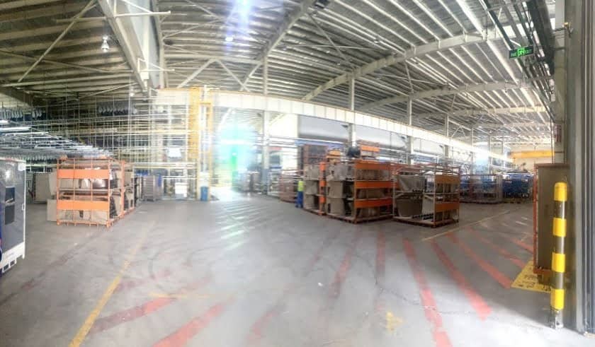 Interior photographs of the 16,000 square metre high and low span main factory building